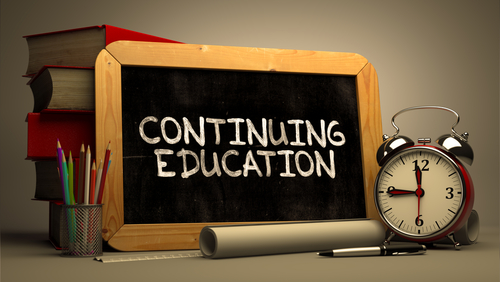 image of a chalkboard saying continuing education along with an alarm clock