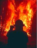 image: fireman fighting blaze